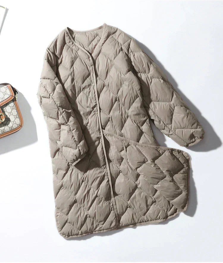 Gewatteerde warme dames jas met lange pasvorm en rits