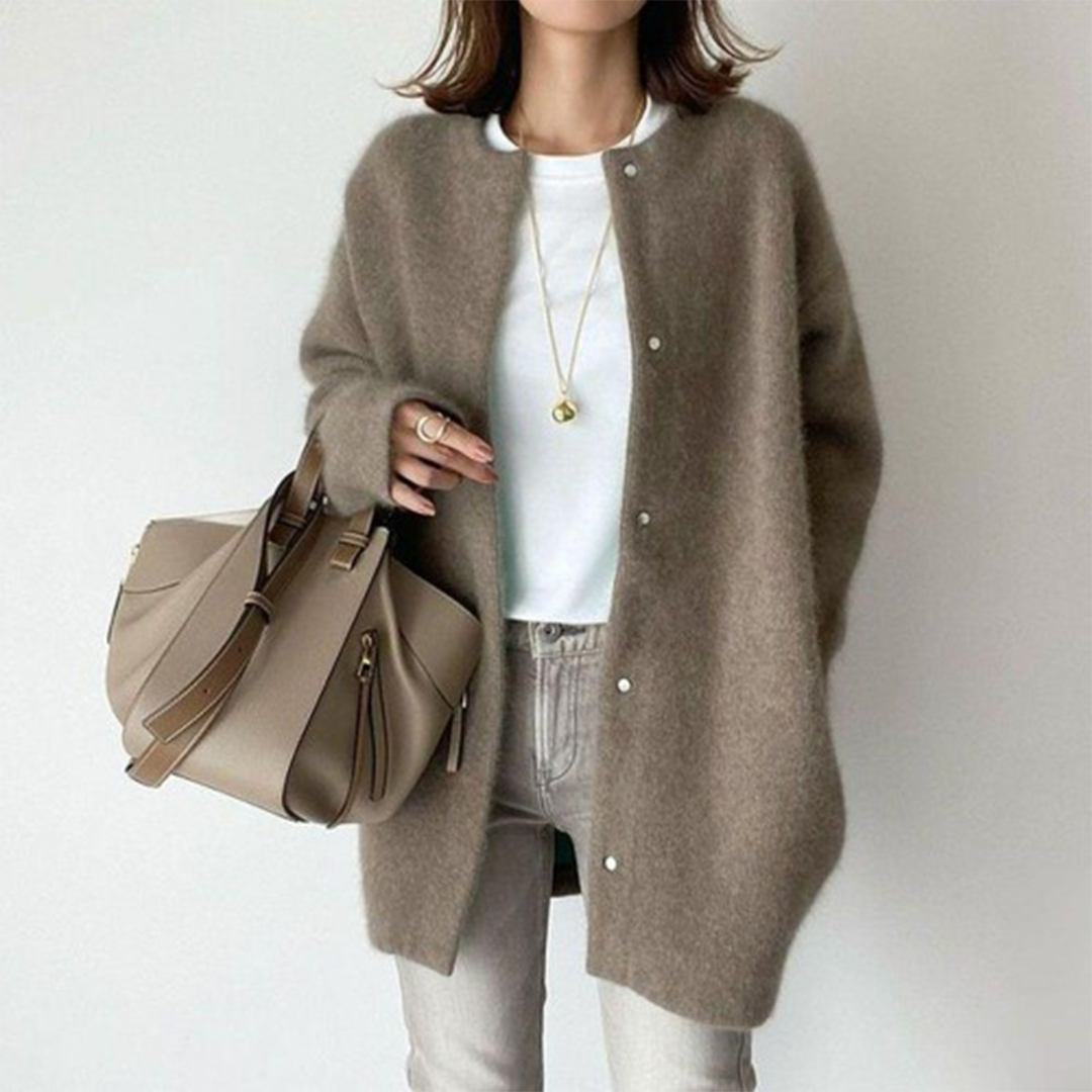 Lichte oversized dames jas met knoopsluiting en lange pasvorm
