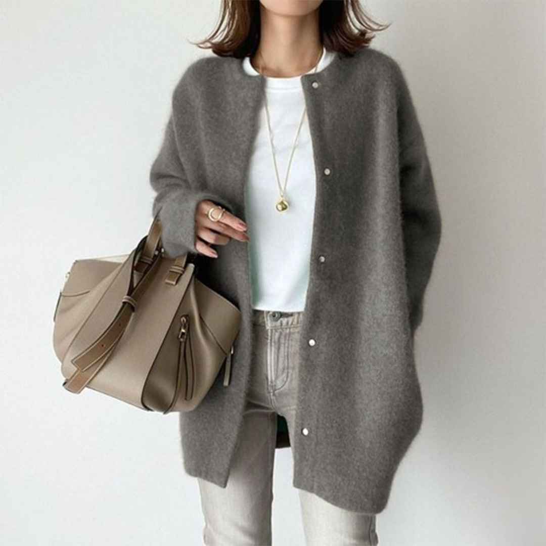 Lichte oversized dames jas met knoopsluiting en lange pasvorm