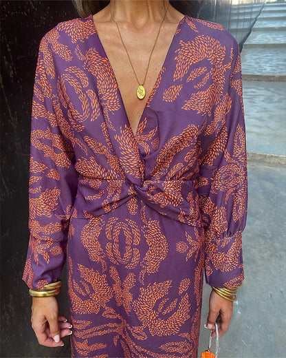 Stijlvolle chique dames midi jurk met twistdetail en luxe print