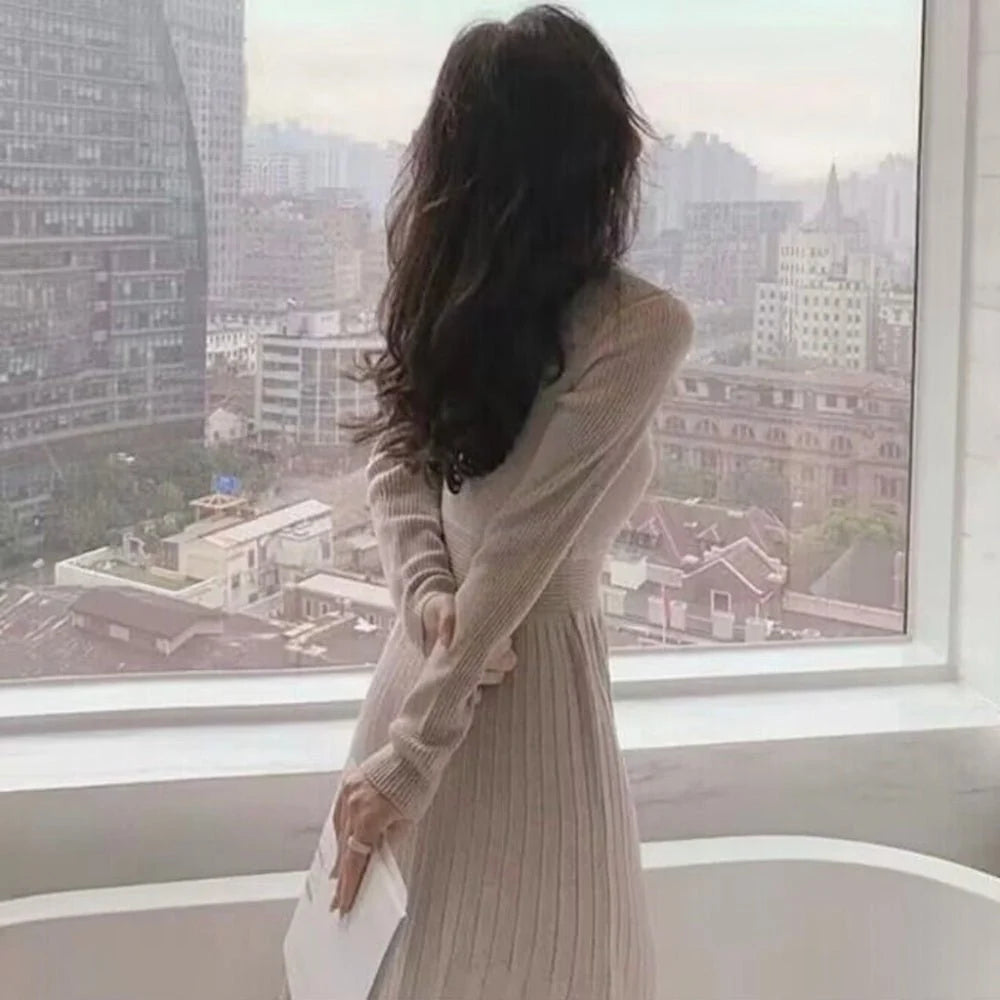 Pleated women's dress with fitted bodice and flowing skirt