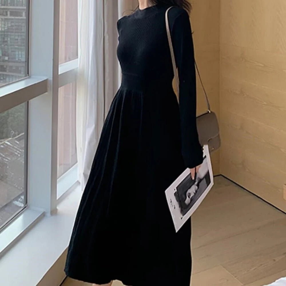 Pleated women's dress with fitted bodice and flowing skirt