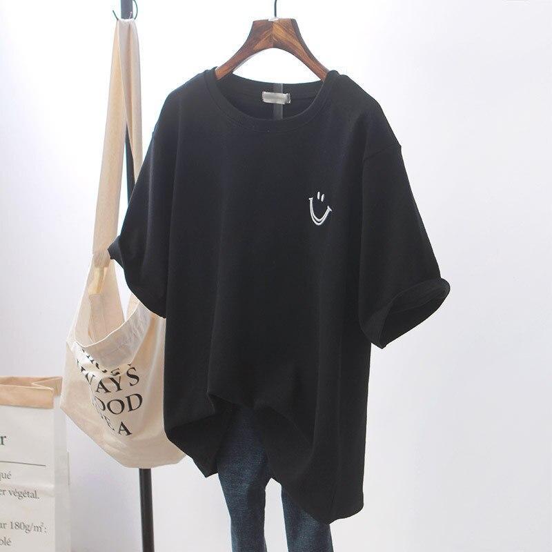 Claudia | Oversize'owy t-shirt z uśmiechem